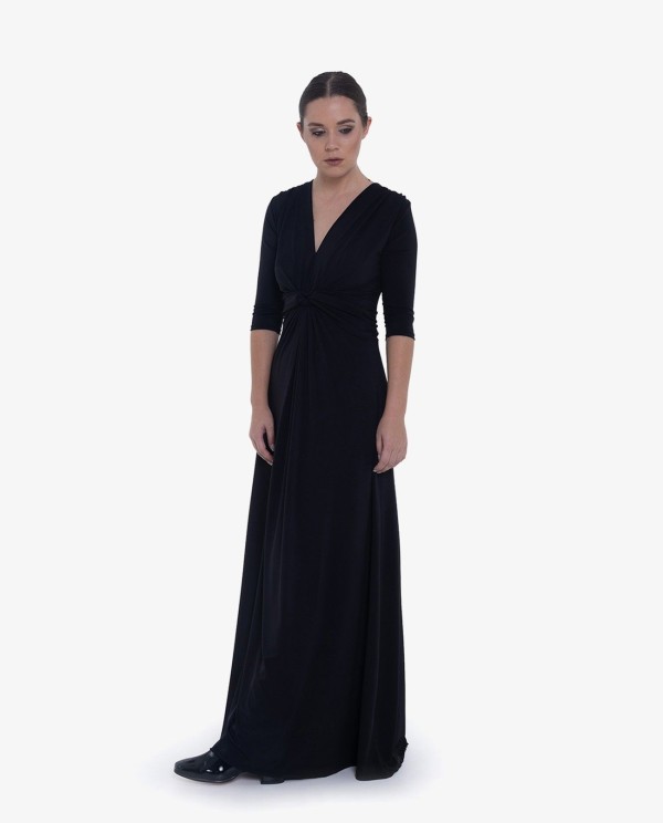 Cuplé MAXI VESTIDO NEGRODE PUNTO CON NUDO FRONTAL Y MANGAS TRES CUARTOS Devoluciones gratuitas