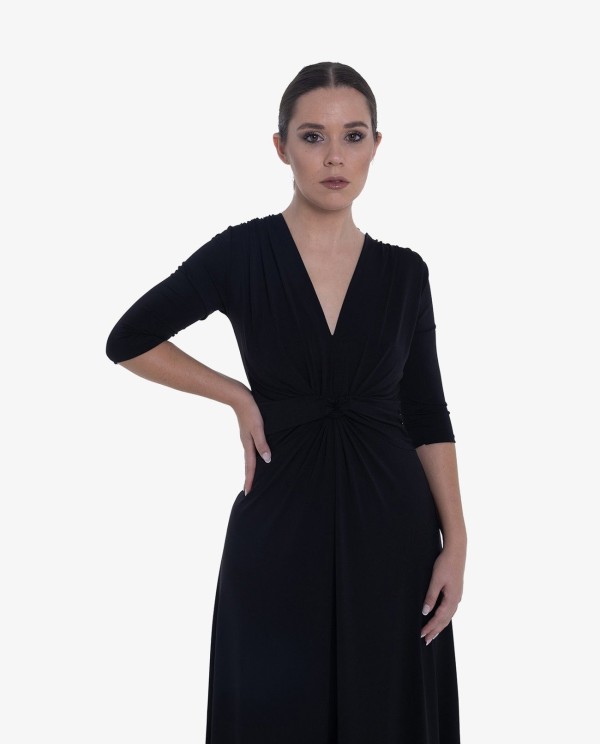 Cuplé MAXI VESTIDO NEGRODE PUNTO CON NUDO FRONTAL Y MANGAS TRES CUARTOS Devoluciones gratuitas